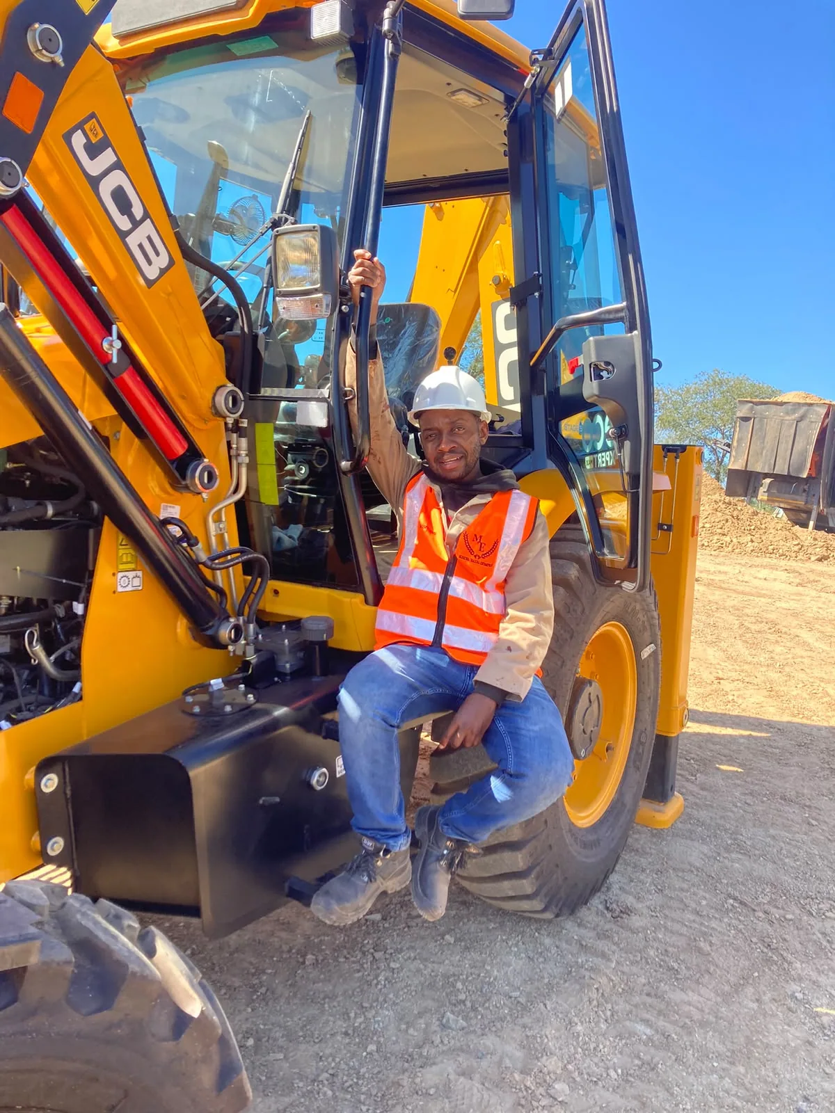 Machine operator seated on a front-end loader at work